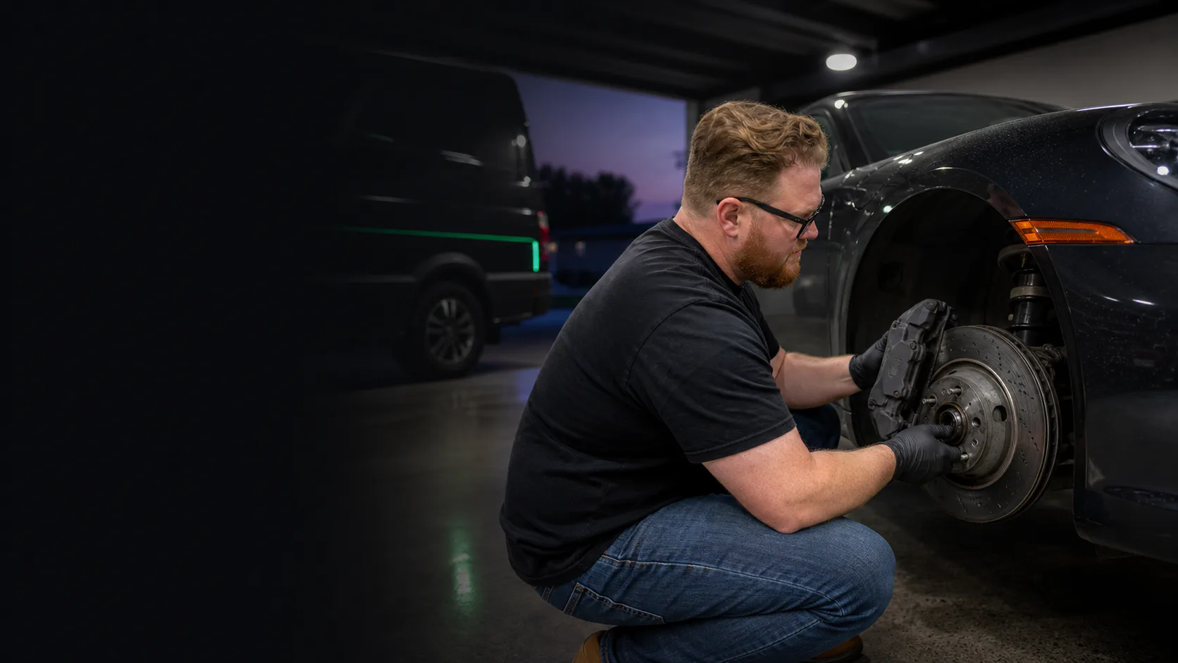 Mobile mechanic repairing a vehicle beside a service van in Orlando at night