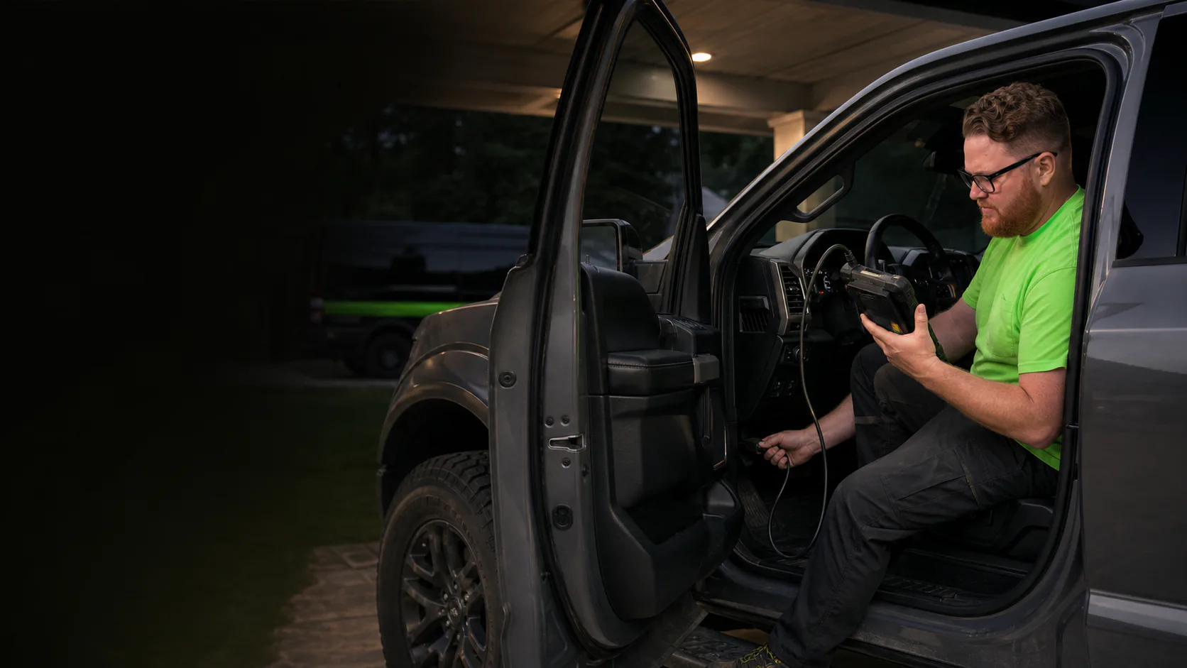 Mobile mechanic repairing a vehicle beside a service van in Orlando at night